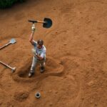 How do you break up hard compacted clay soil